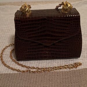 Rare Larucchi Tiger box bag.
Crocodile-Embossed with Gold Accents.